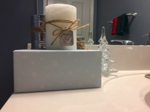 Candles and glass tree in bathroom