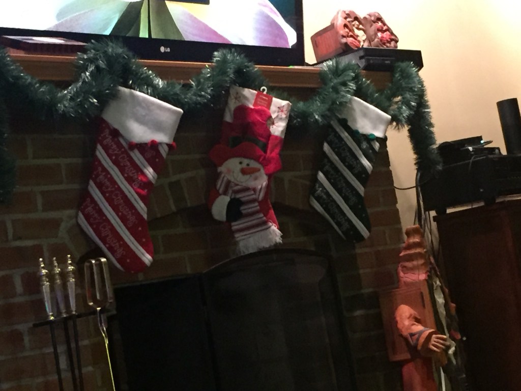 Stockings and garland over fireplace